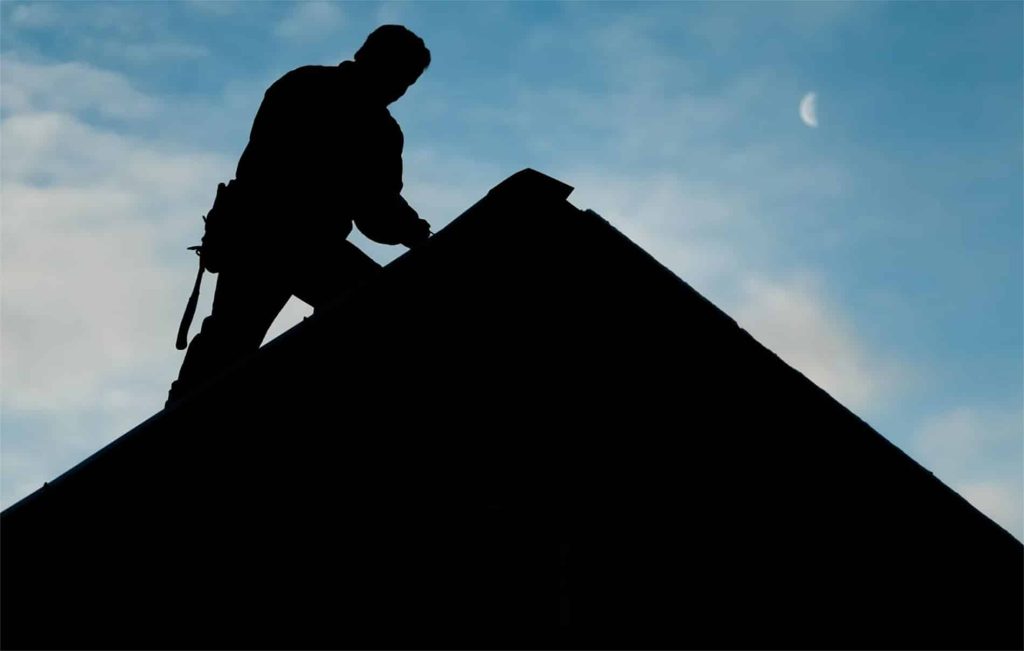 Man on Roof 12 Stones - common roof issues - 12 Stones Roofing