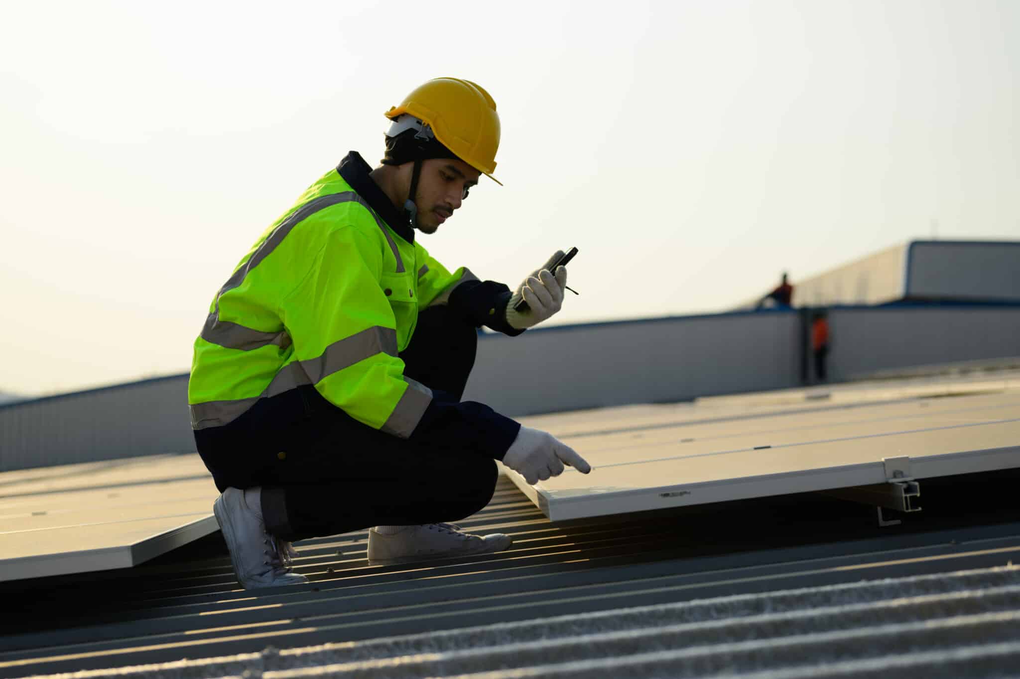 Man Inspecting roof for roof replacement